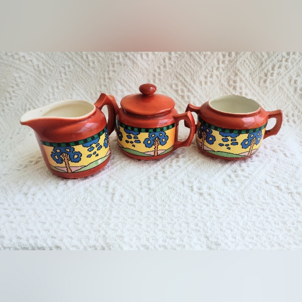 Vintage Ditmar Urbach orange pottery Pitcher, Creamer, and Sugar Set.